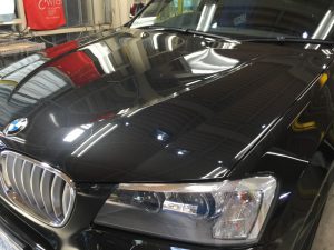 BMWX3・ジーゾックス・ハイドロフィニッシュ施工後の助手席側ヘッドライト付近