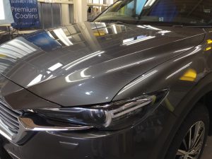 CX8・プレミアムコーティング後の助手席側ヘッドライト付近
